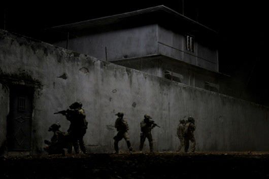 In the darkest hour of the night, elite Navy SEALs raid Osama Bin Laden's compound in Columbia Pictures'  ultra realistic new thriller from director Kathryn Bigelow, about the greatest manhunt in history, ZERO DARK THIRTY. Courtesy Sony Pictures