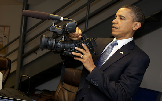 POTUS handling a new digital camera.