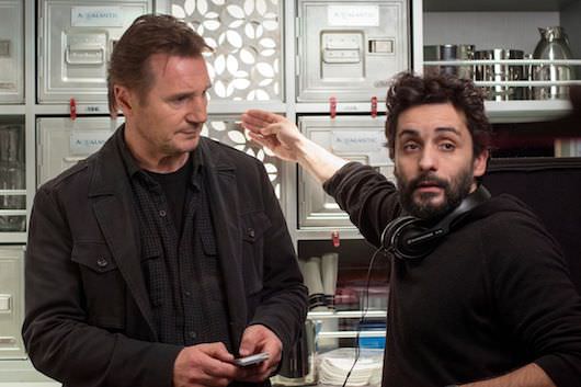 Liam Neeson listens to director Jaume Collet-Serra on the incredibly cramped set of 'Non-Stop.' Courtesy Universal Pictures.