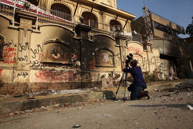 Filming the burnt out former Muslim Brotherhood headquarters in Cairo.