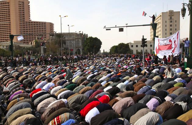 A calm moment during the revolution when Friday midday prayer began in Tahrir Square. Photo by Rachel Beth Anderson.