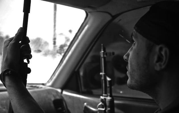 Hamid, one of the main characters in the film, concentrates during his commute out to the frontline. Photo by Rachel Beth Anderson.