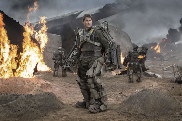 Mud splattered, largely monochromatic and very real—the ExoSuits look like battle armor for a near future war. Courtesy Warner Bros. Pictures.