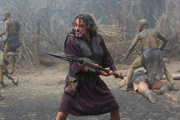 Ian McShane is Amphiaraus, with a Bessi warrior, and his tell tale diamondback tattoo created by Conor O'Sullivan, behind him. Courtesy Paramount Pictures.