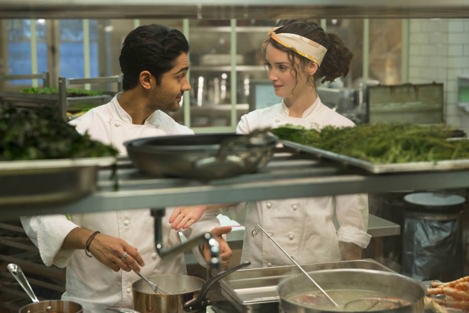 Hassan (Manish Dayal) and Marguerite (Charlotte Le Bon) are competitors who are finding more in common then they bargained for. Courtesy Walt Disney Studios. 