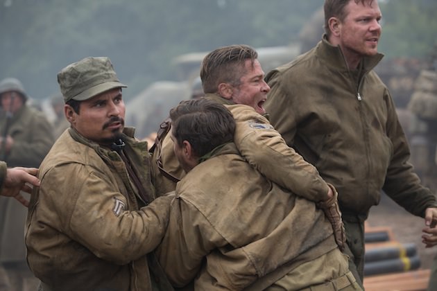 Trini "Gordo" Garcia (Michael Pena), Boyd "Bible" Swan (Shia LeBeaouf) and Sergeant Binkowski (Jim Parrack) try to hold back Wardaddy (Brad Pitt) as he attacks an SS Sergeant in Columbia Pictures' FURY.