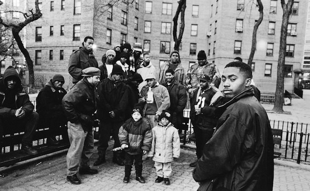 Nas on the far right, in front of friends and neighbors in Queensbridge. Photo by Danny Clinch. 