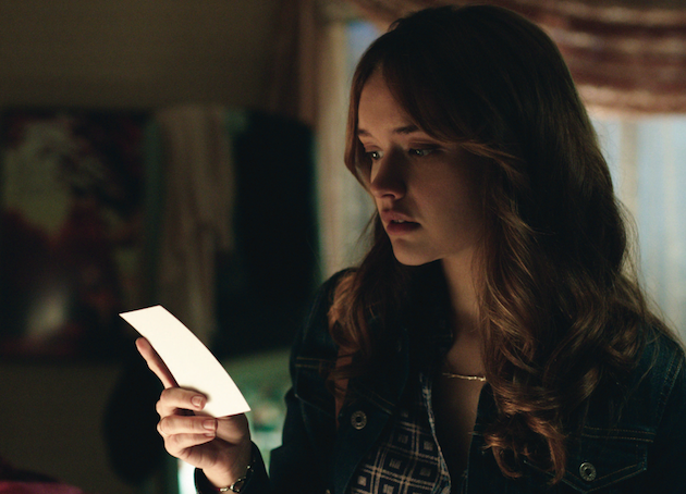 Laine (Olivia Cooke) figuring out she might have to play an old board game to find out what happened to her pal. Courtesy Universal Pictures.
