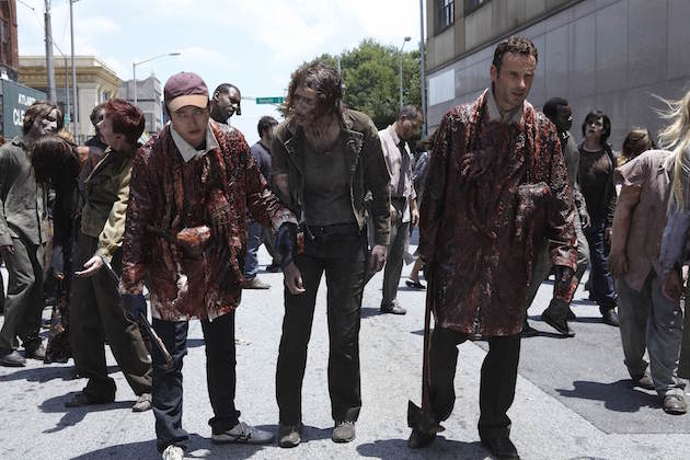 Rick and Glenn (Steven Yeun) go unnoticed by walkers thanks to the guts and limbs covering their body. Courtesy AMC. 