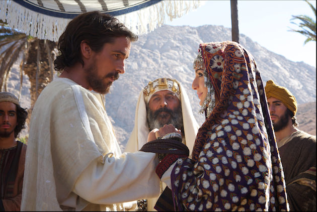 Moses (Christian Bale) weds Zipporah (María Valverde) with her father, Jethro (Kevork Mailkyan, center). Courtesy 20th Century Fox. 