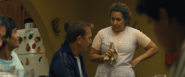 McFARLAND, USA..L to R: Damacio Diaz (Michael Aguero), Coach Jim White (Kevin Costner), and Se?ora Diaz (Diana Maria Riva). Courtesy Walt Disney Studios