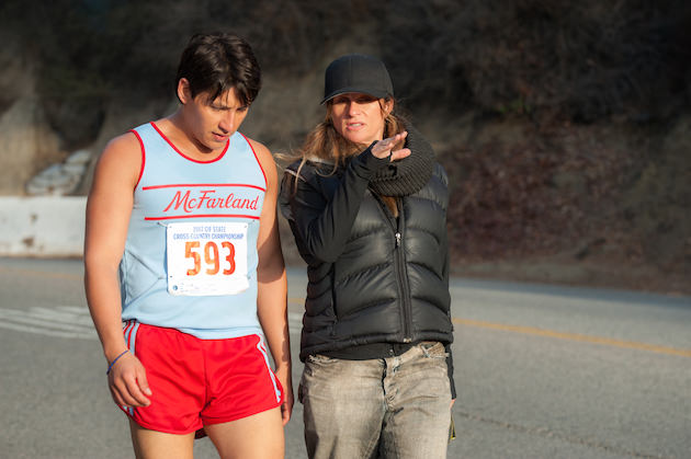 McFARLAND, USA..L to R: Actor Carlos Pratts (Thomas Valles) and Director Niki Caro on set of McFarland, USA. Photo by Ron Phillips.  Courtesy Walt Disney Studios 2015