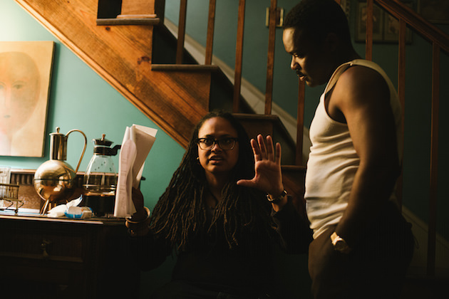 Left to right: Director/Executive Producer Ava DuVernay discusses a scene with David Oyelowo (as Dr. Martin Luther King, Jr.) on the set of SELMA, from Paramount Pictures, Pathé, and Harpo Films. SEL-10837