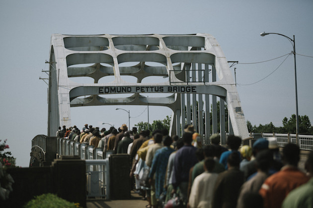 Marchers cross the Edmund Pettus Bridge in SELMA, from Paramount Pictures, Pathé, and Harpo Films. SEL-14596