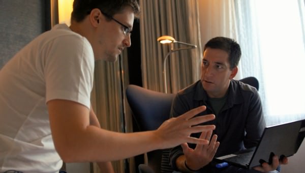 Snowden and journalist Glenn Greenwald in Snowden's hotel room in Hong Kong. Courtesy Raidus-TWC.