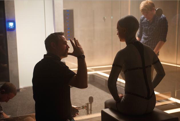 Garland, Vikander and Domhnall Gleeson discuss a scene. Courtesy A24. 