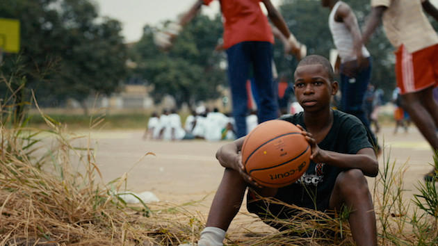 A young basketball lover in Congo, who plays in shoes that are falling apart, as Ibaka once did when he was his age. Courtesy Grantland