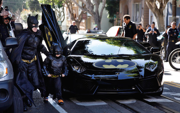 Caption: (L-r) EJ JOHNSTON as Batman and MILES SCOTT as Batkid in New Line Cinema's documentary "Batkid Begins," A Warner Bros. Pictures release.