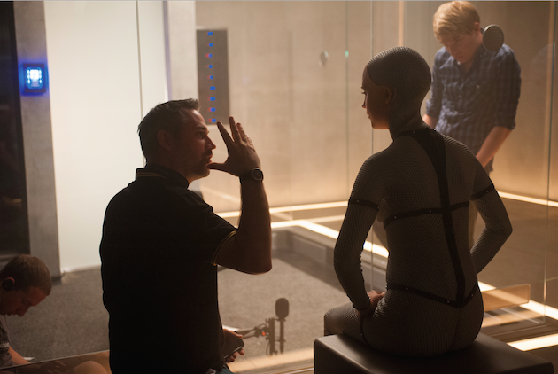 Writer/directorAlex Garland talks to Alicia Vikander, with Domhnall Gleeson in the background. Gleeson is the one in the fishbowl in Digby's design. Courtesy A24.