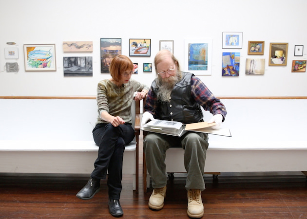 Jane Anderson and Jim Zim look at some of Edith's work. 