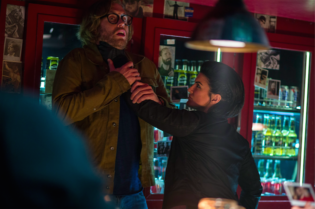 Angel Dust (Gina Carano) roughs up barkeep Weasel (T.J. Miller). Photo by Joe Lederer. Courtesy 20th Century Fox