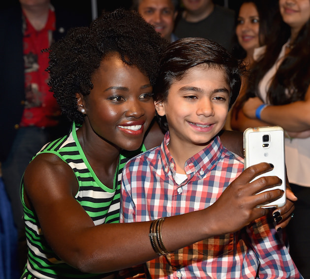ANAHEIM, CA - AUGUST 15: Actors Lupita Nyong'o (L) and Neel Sethi of THE JUNGLE BOOK took part today in "Worlds, Galaxies, and Universes: Live Action at The Walt Disney Studios" presentation at Disney's D23 EXPO 2015 in Anaheim, Calif. (Photo by Alberto E. Rodriguez/Getty Images for Disney) *** Local Caption *** Lupita Nyong'o; Neel Sethi