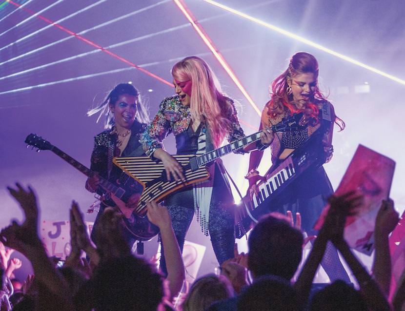(L to R) Aja (HAYLEY KIYOKO), Jem (AUBREY PEEPLES) and Kimber (STEFANIE SCOTT) in "Jem and the Holograms". As a small-town girl catapults from underground video sensation to global superstar, she and her three sisters begin a one-in-a-million journey of discovering that some talents are too special to keep hidden.  Byline:Photo Credit: Justina Mintz / Universal Pictures