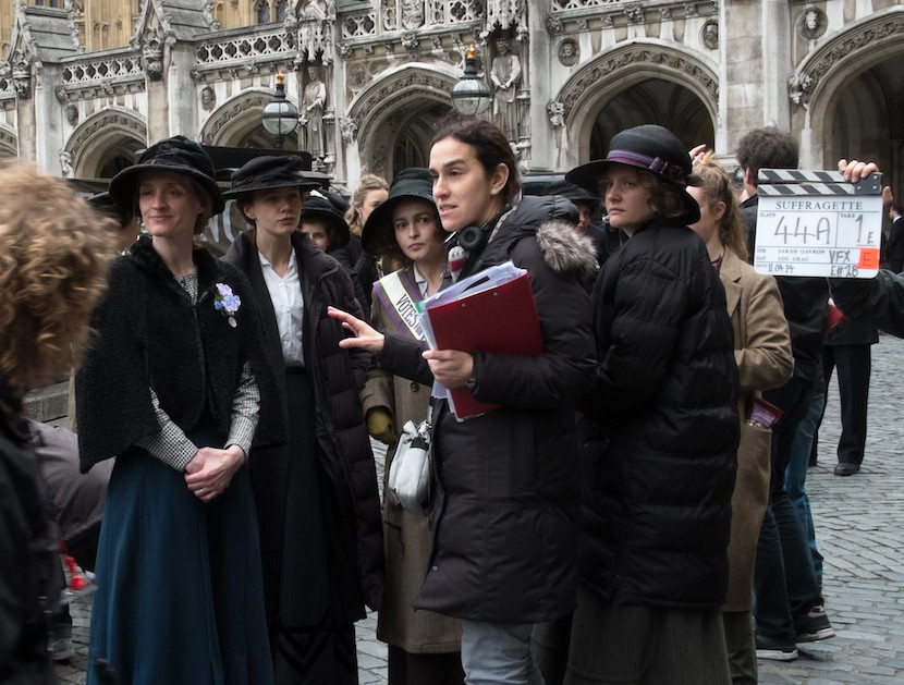 (L to R) Actress Anne-Marie Duff, actress Carey Mulligan, actress Helena Bonham Carter, director Sarah Gavron, and actress Romola Garai on the set of SUFFRAGETTE, a Focus Features release.  Credit : Steffan Hill / Focus Features