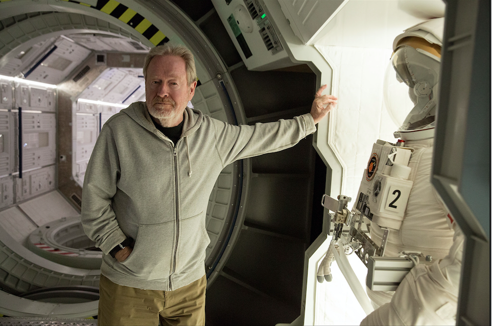 Ridley Scott poses on the set of the spaceship Hermes. The stunt and FX crew created an elaborate winch system to re-create zero gravity. Photo by Giles Keyte. Courtesy 20th Century Fox