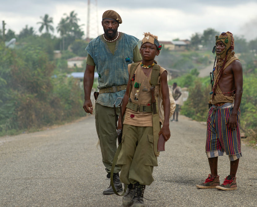 Idris Elba and Abraham Attah in the Netflix original film "Beasts of No Nation". Courtesy Netflix.