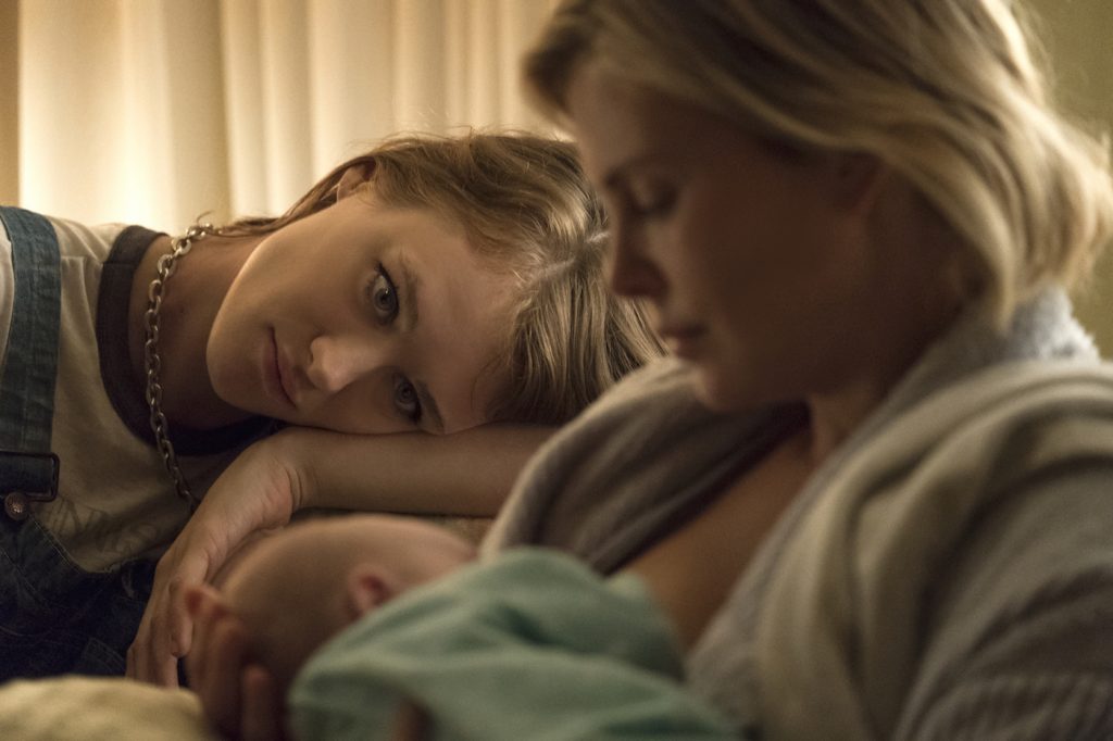 Mackenzie Davis as Tully and Charlize Theron as Marlo
