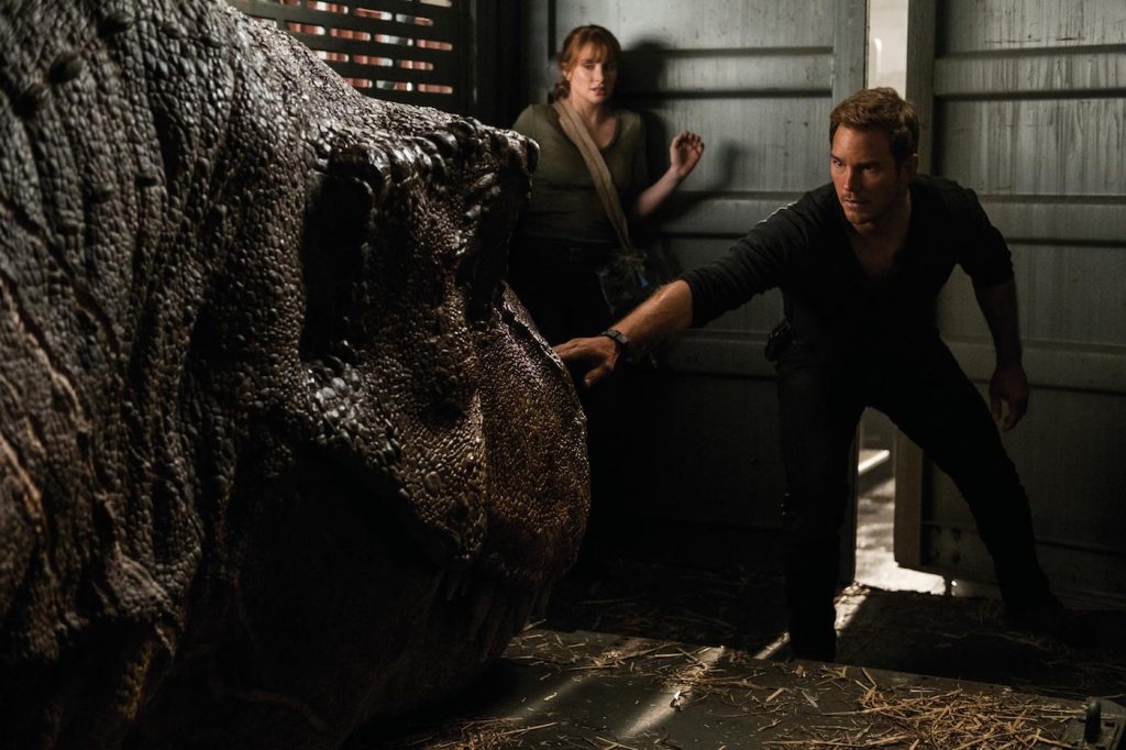 Claire (BRYCE DALLAS HOWARD) and Owen (CHRIS PRATT) try not to wake the mighty T. rex in "Jurassic World: Fallen Kingdom." When the island's dormant volcano begins roaring to life, Owen and Claire mount a campaign to rescue the remaining dinosaurs from this extinction-level event. Welcome to "Jurassic World: Fallen Kingdom." Photo Credit: Giles Keyte