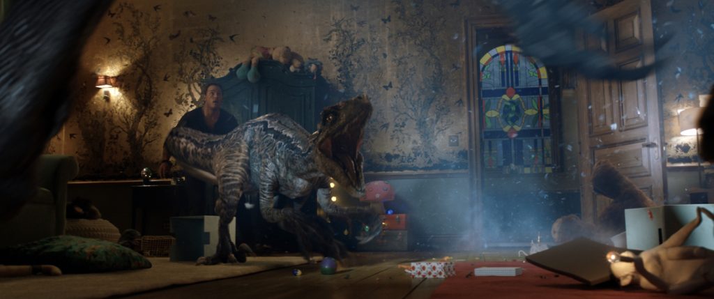 Owen (CHRIS PRATT) and Blue face off against the monstrous Indoraptor in "Jurassic World: Fallen Kingdom." When the island's dormant volcano begins roaring to life, Owen and Claire mount a campaign to rescue the remaining dinosaurs from this extinction-level event. Welcome to "Jurassic World: Fallen Kingdom." Photo Credit: Universal Studios and Amblin Entertainment, Inc. and Legendary Pictures Productions, LLC.