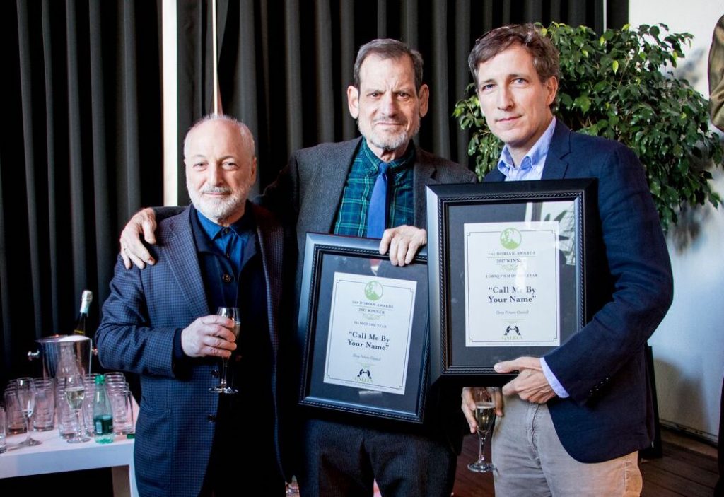 From left: Call Me by Your Name author André Aciman and the film version’s producers Howard Rosenman and Peter Spears accept awards at the 2017 Dorian Awards Winners Toast.