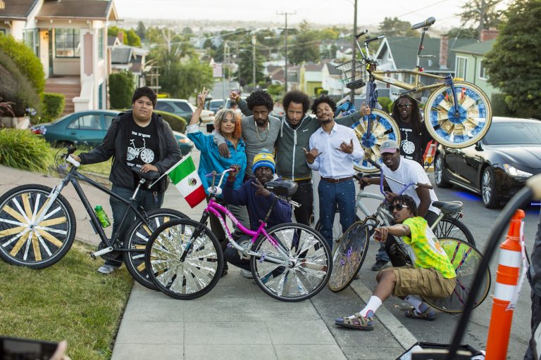 (l to r.) Tessa Thompson, Lakeith Stanfield, director Boots Riley, and Jermaine Fowler on the set of SORRY TO BOTHER YOU, an Annapurna Pictures release. Credit: Pete Lee / Annapurna Pictures