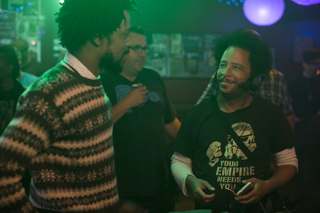 (l to r.) Lakeith Stanfield and director Boots Riley on the set of SORRY TO BOTHER YOU, an Annapurna Pictures release. Credit: Peter Prato / Annapurna Pictures