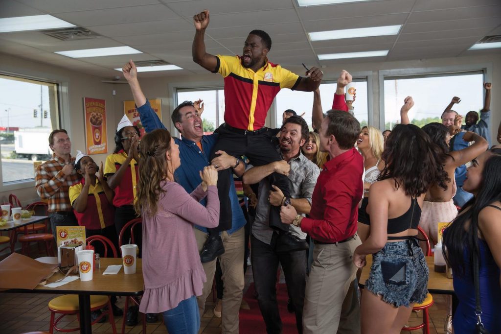 Teddy Walker (KEVIN HART) celebrates a rare academic victory, hailed by his fellow students (clockwise from lower left) Theresa (MARY LYNN RAJSKUB), Mackenzie (ROB RIGGLE), and Luis (AL MADRIGAL), and others in "Night School," the new comedy from director Malcolm D. Lee ("Girls Trip") that follows a group of misfits who are forced to attend adult classes in the long shot chance they'll pass the GED exam. Photo Credit: Eli Joshua Adé