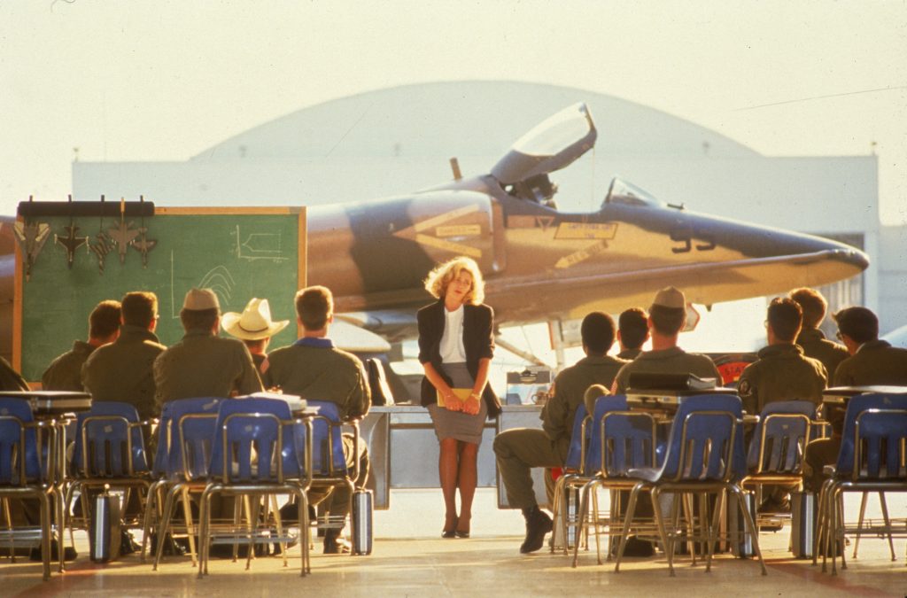 Kelly McGillis briefing the Navy pilots in the original 'Top Gun.' Courtesy Paramount Pictures.