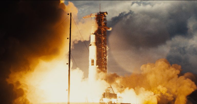 Final Composite of Apollo 11 launch. We augmented archival 70mm NASA footage of the Apollo 14 launch. To create a more cinematic visual we reframed it, cleaned it up and the extended the sides with CG smoke and sky to match. Courtesy Paul Lambert/Universal Pictures.