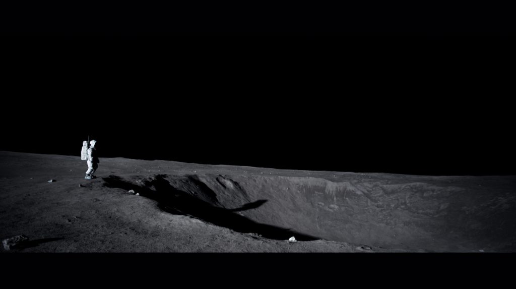 Final composite of Neil standing in front of crater on the moon. Neil throws daughters bracelet into the crater. We deepened the crater to give illusion of black hole as well as set clean up. Light fall off was extended to mimc the sunlight on moon in addition to set extensions.