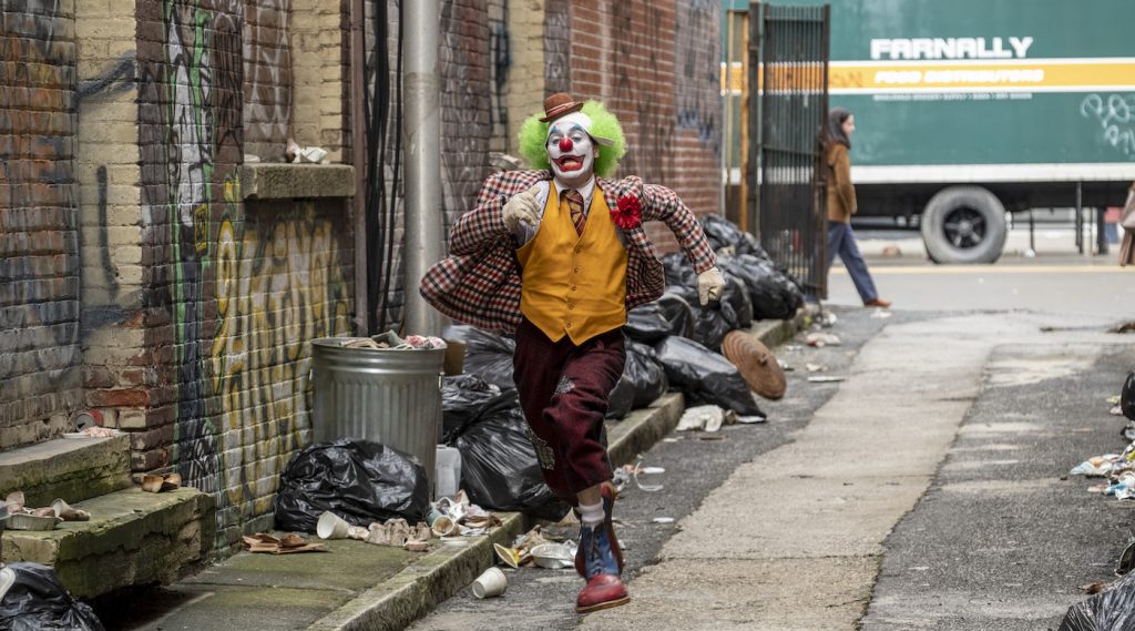 Caption: JOAQUIN PHOENIX as Arthur Fleck in Warner Bros. Pictures, Village Roadshow Pictures and BRON Creative’s “JOKER,” a Warner Bros. Pictures release. Photo Credit: Niko Tavernise