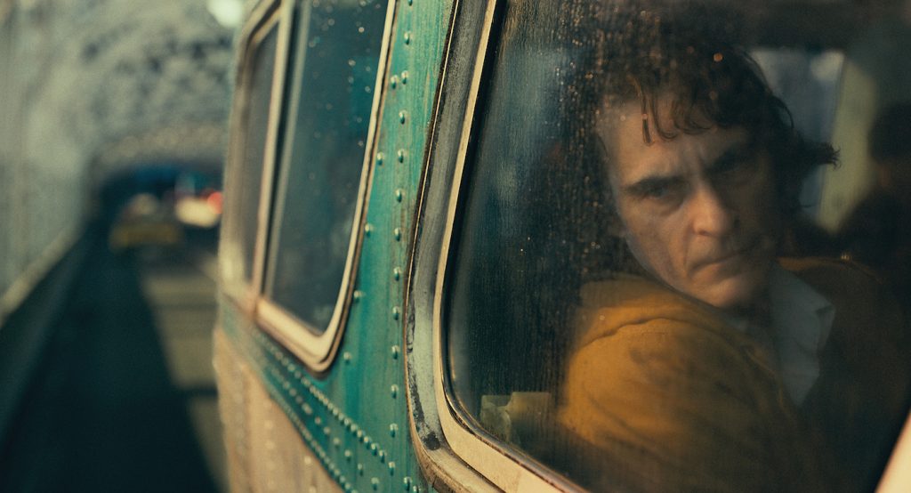 Caption: JOAQUIN PHOENIX as Arthur Fleck in Warner Bros. Pictures, Village Roadshow Pictures and BRON Creative’s “JOKER,” a Warner Bros. Pictures release. Photo Credit Warner Bros.