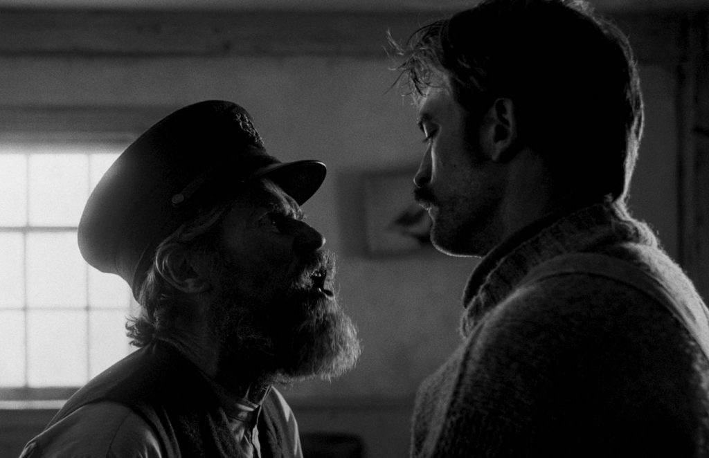 L-r: Willem Dafoe and Robert Pattinson in 'The Lighthouse.' Courtesy A24