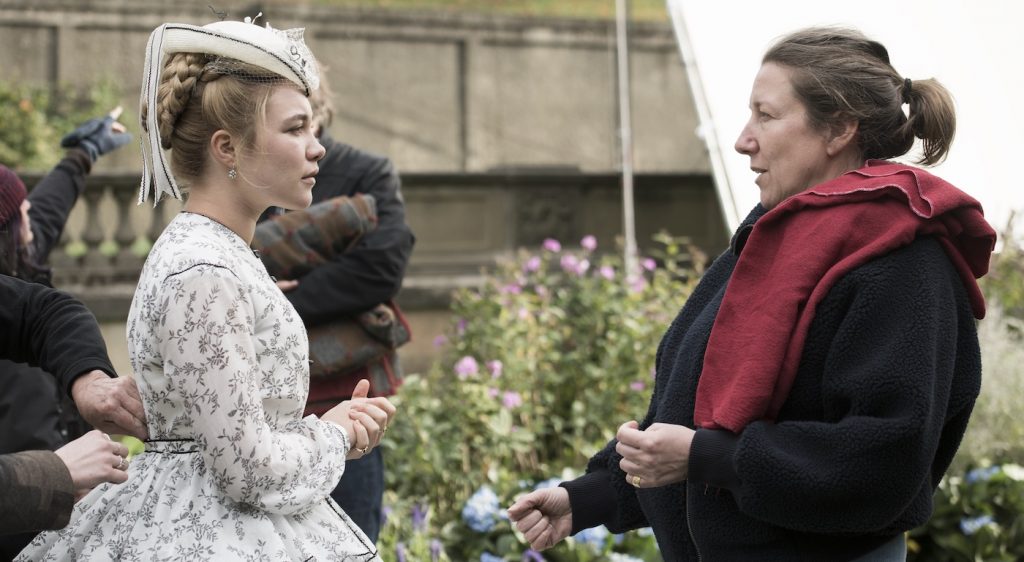 BTS: Amy March (Florence Pugh), Costume Designer Jacqueline Durran on the set of Columbia Pictures' LITTLE WOMEN." Photo by Wilson Webb. Courtesy Sony Pictures.