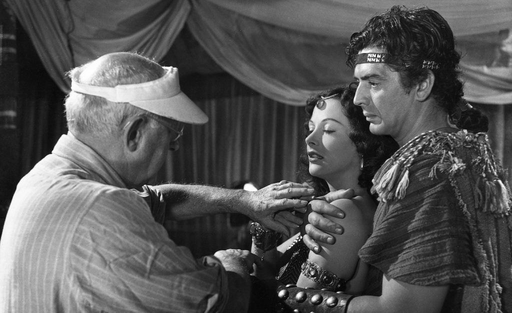 L-r: Director Cecille B. DeMille, Hedy Lamarr, and Victor Mature.