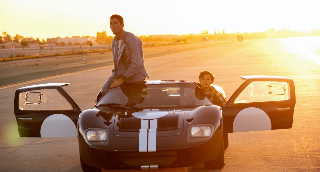 Christian Bale and Noah Jupe in Twentieth Century Fox’s FORD V FERRARI. Photo Credit:Merrick Morton. Courtesy 20th Century Fox/Walt Disney Studios