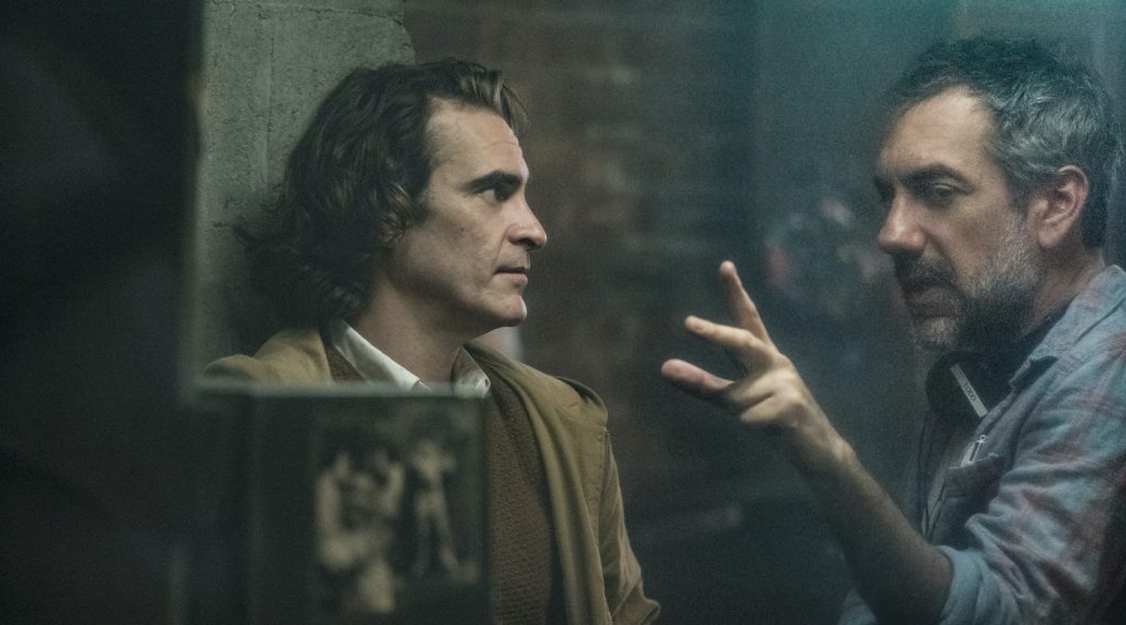 L-r: Joaquin Phoenix and director Todd Phillips on the set of 'Joker.' Photo Credit: Niko Tavernise/Warner Bros.