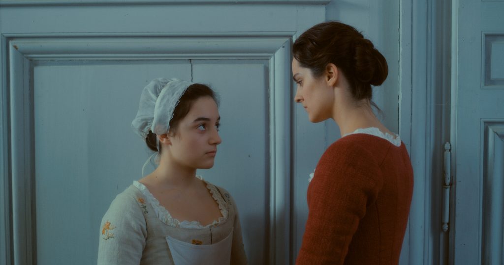 L-r: Luàna Bajrami is Sophie and Noémi Merlant is Marianne in 'Portrait of a Lady on Fire.' Courtesy Neon.