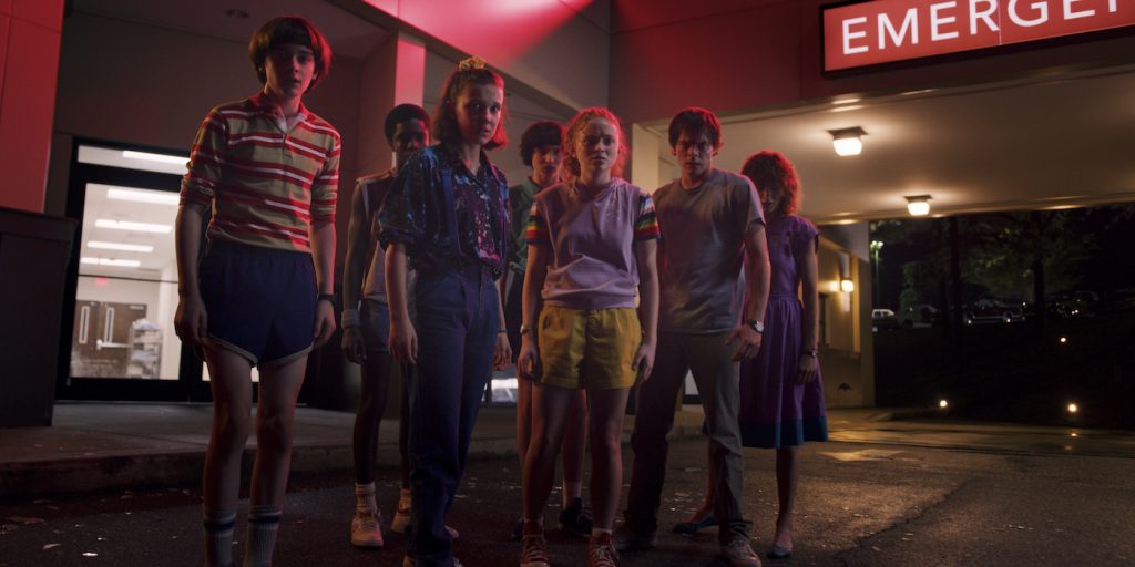 L-r: Noah Schnapp, Caleb McLaughlin, Millie Bobby Brown, Finn Wolfhard, Sadie Sink, Charlie Heaton, Natalia Dyer in 'Stranger Things' season 3. Courtesy Netflix.