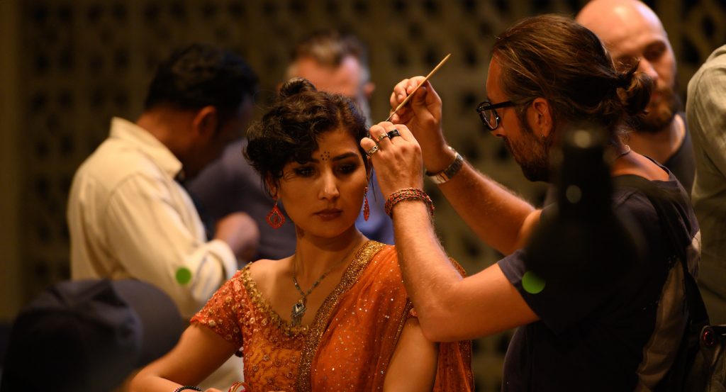 Luca Vanella doing the hair for Golshifteh Farahani. Courtesy of Netflix. 